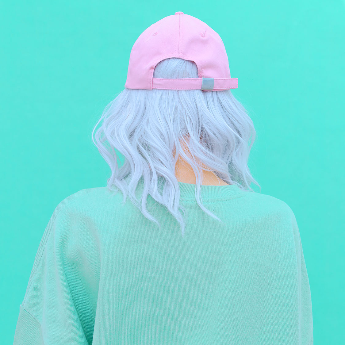 Aesthetic girl in stylish accessories b-boy cap. Fresh pastel co