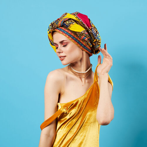 beautiful woman in multicolored turban attractive look Jewelry smile Studio Model beautiful woman in multicolored turban attractive look Jewelry smile Studio Model. High quality photo