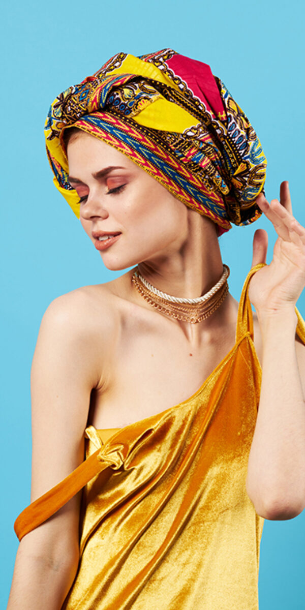 beautiful woman in multicolored turban attractive look Jewelry smile Studio Model beautiful woman in multicolored turban attractive look Jewelry smile Studio Model. High quality photo