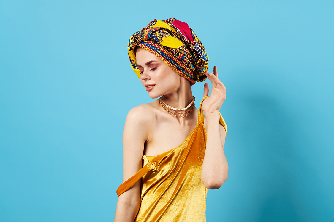 beautiful woman in multicolored turban attractive look Jewelry smile Studio Model