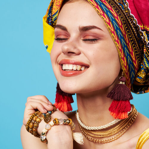 cheerful woman multicolored shawl ethnicity african style decorations Studio Model. High quality photo