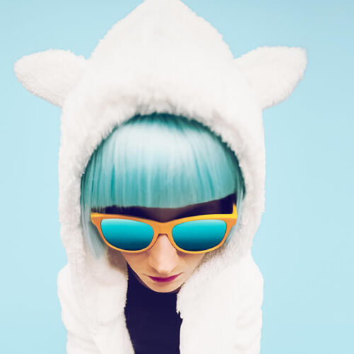 fashion-girl-in-hoodie-teddy-bear-on-a-blue-backgr-2024-09-18-11-15-53-utc