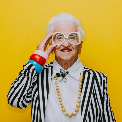 Funny grandmother portraits. Senior old woman dressing elegant for a special event. granny fashion model on colored backgrounds