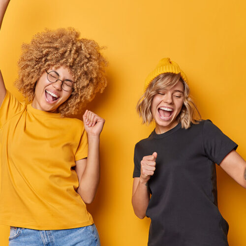 glad-carefree-young-women-dance-and-chill-indoor-d-2023-11-27-05-36-55-utc