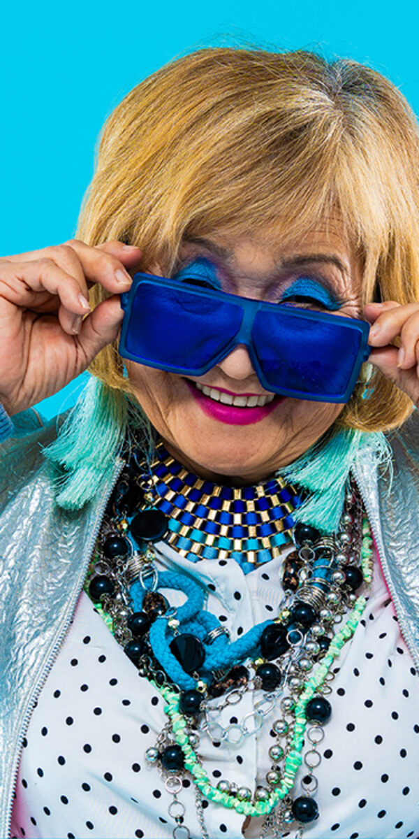 Happy and funny senior old woman on colorful background Happy and funny senior old woman wearing fashinable clothing on colorful background- Modern cool fancy grandmother portrait, concepts about elderly and older people