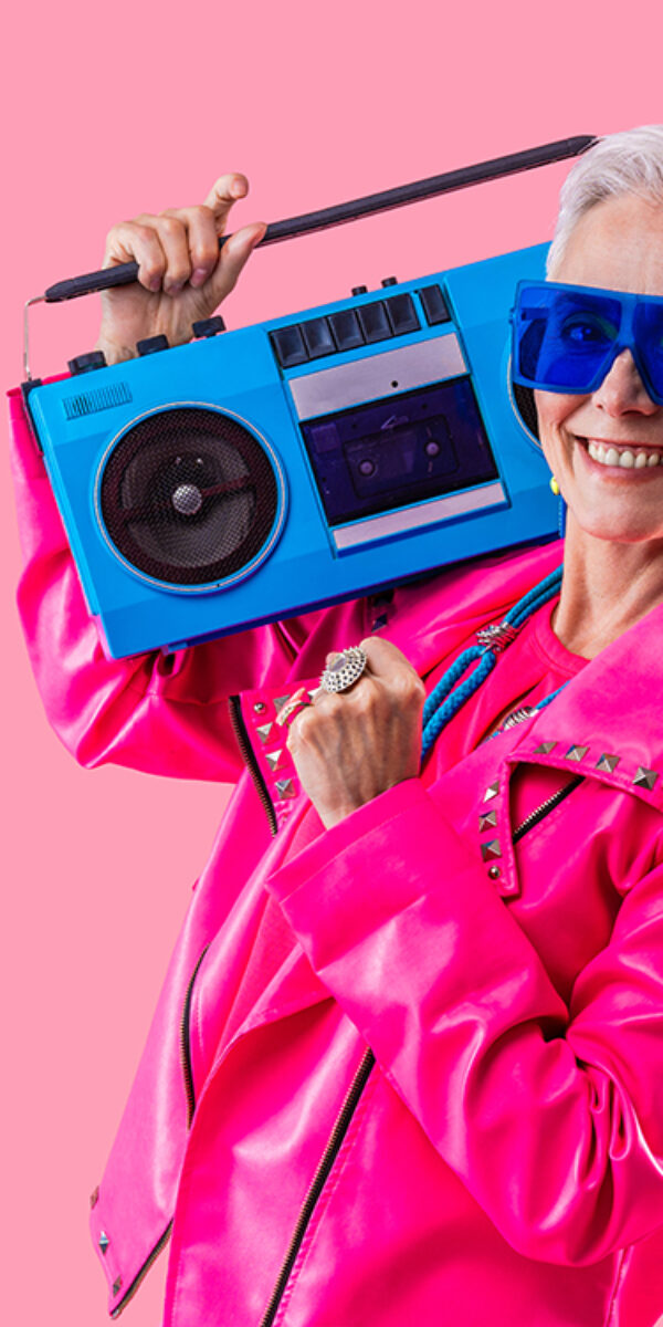 Happy and funny senior old woman wearing fashinable clothing on colorful background- Modern cool fancy grandmother portrait, concepts about elderly and older people