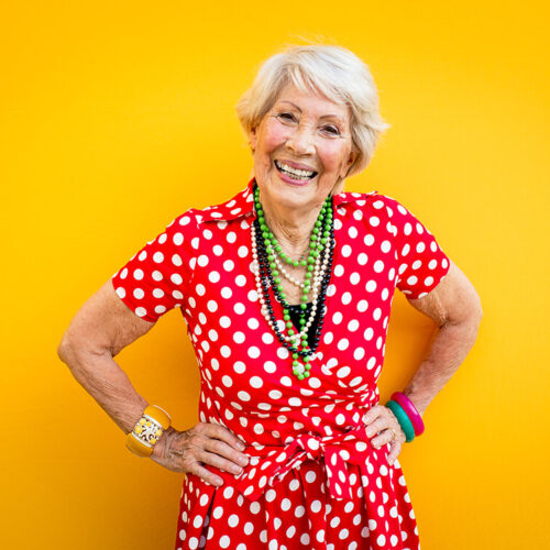 happy-grandmother-posing-on-colored-backgrounds-2023-11-27-05-25-21-utc