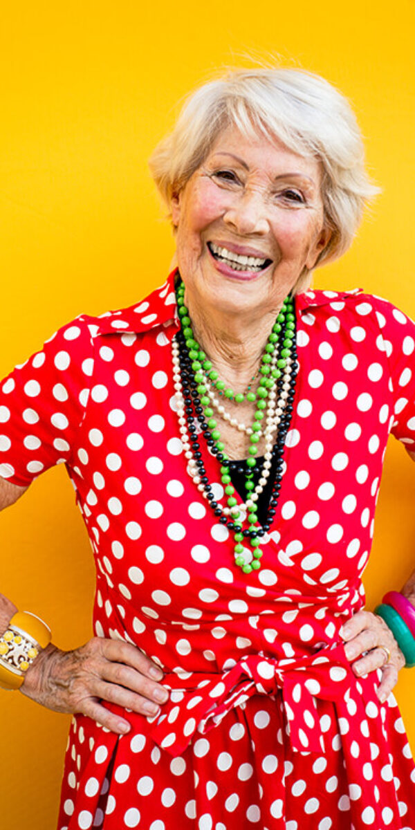 happy-grandmother-posing-on-colored-backgrounds-2023-11-27-05-25-21-utc