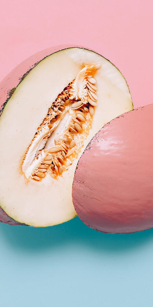 Melon in pink paint. Art gallery Minimal design creative Surreal