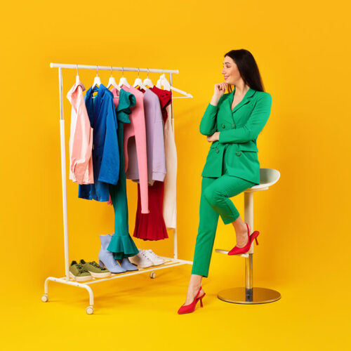 pensive-young-stylish-lady-looking-at-garment-rack-2023-11-27-05-11-36-utc pensive-young-stylish-lady-looking-at-garment-rack-2023-11-27-05-11-36-utc