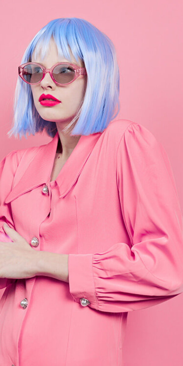 portrait-of-a-woman-in-blue-wig-pink-dress-red-lip-2023-11-27-05-13-30-utc