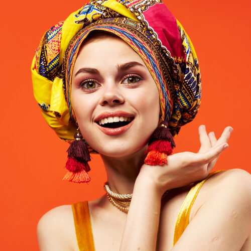 pretty woman in multicolored turban attractive look Jewelry Studio Model. High quality photo