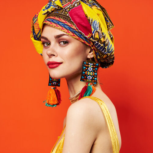 pretty woman in multicolored turban attractive look Jewelry Studio Model. High quality photo