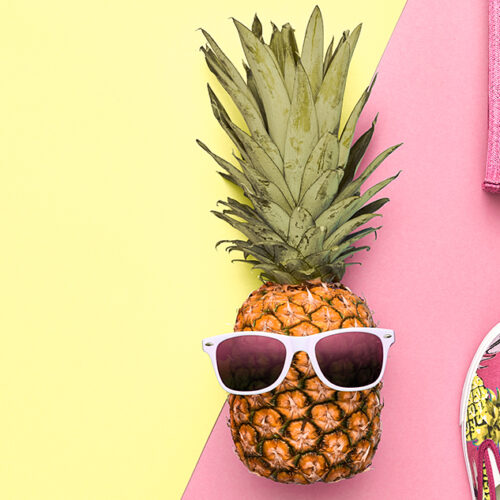 Summer Fashion hipster Pineapple. Accessories minimal look on vivid background. Trendy party fashionable layout, summertime advertising concept, top view