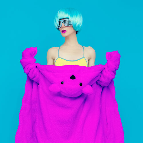 teddy bear girl on a blue background. Crazy winter party. Club dance style